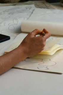 Hand tracing patterns on paper